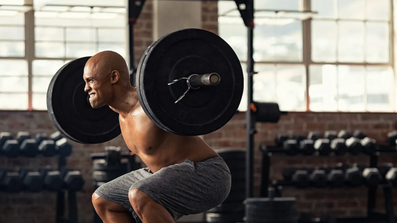 Tight Hips Are Capping Your Squat. Here's What's Going On.